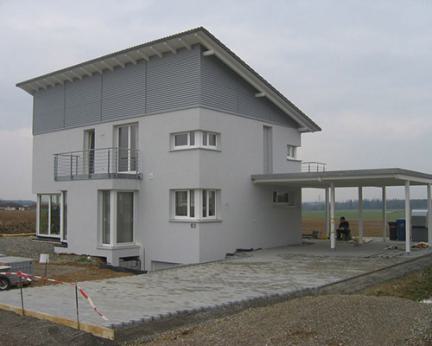 Neubau mit Pultdach und Carport